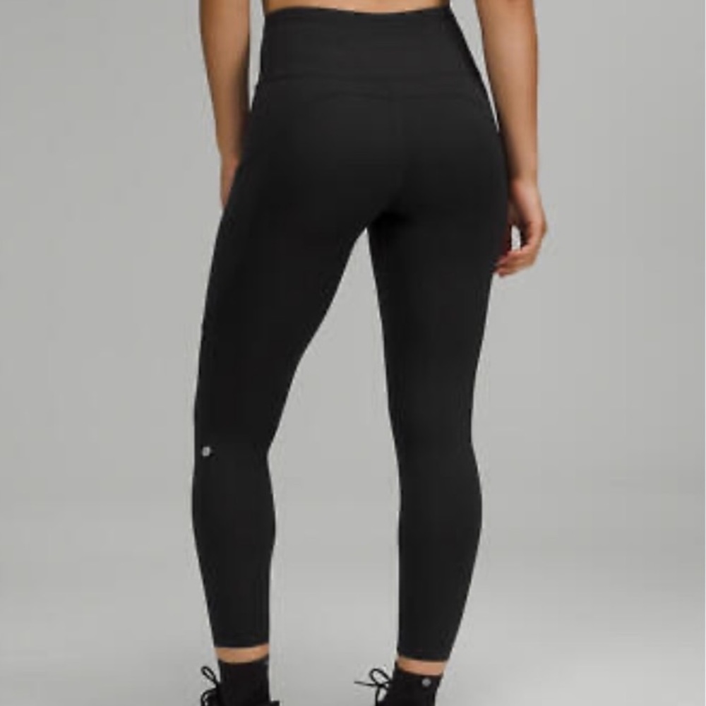 Lululemon black fast and free tights 25 inch size 4